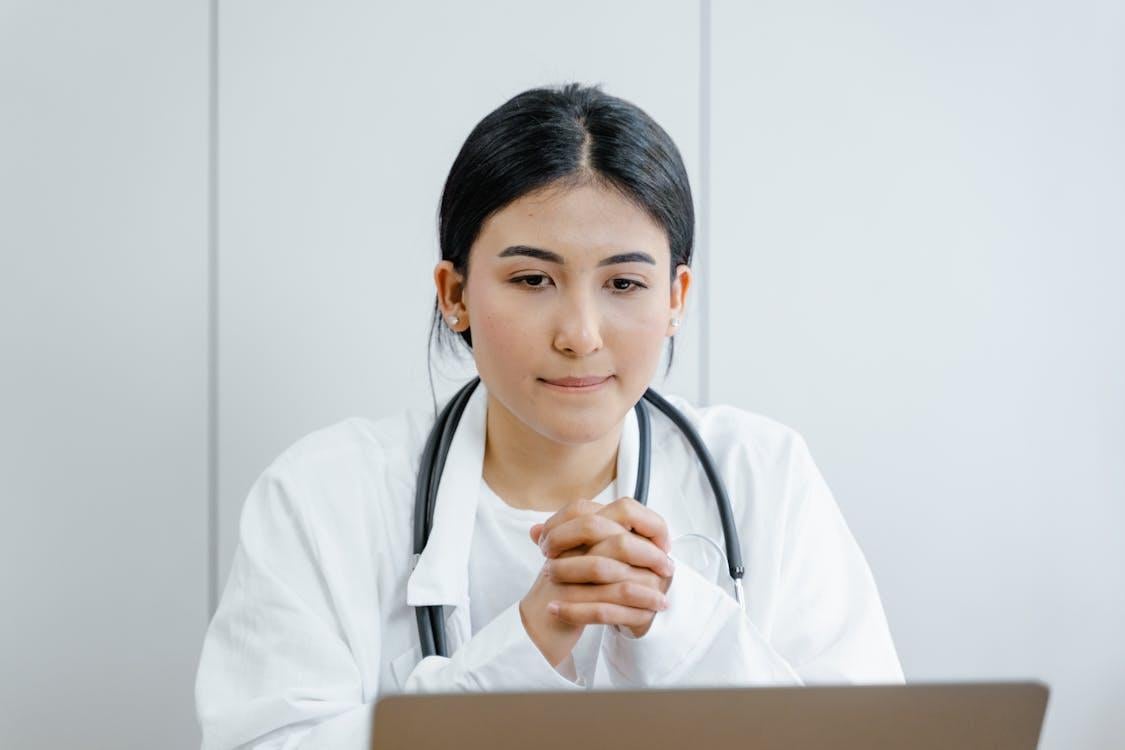 A doctor wears a stethoscope.