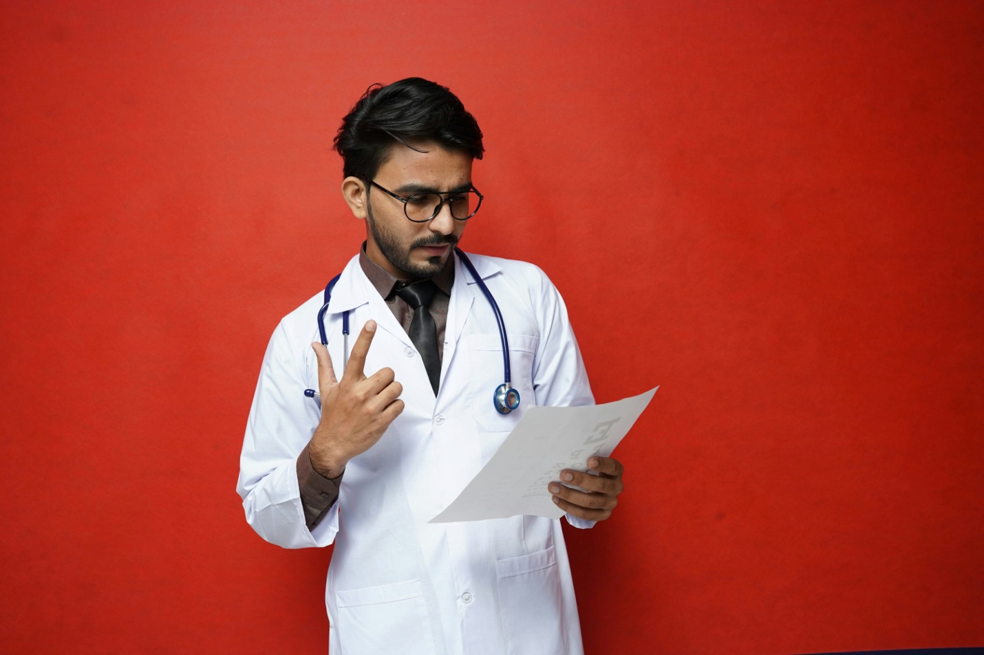 A doctor holding a piece of paper