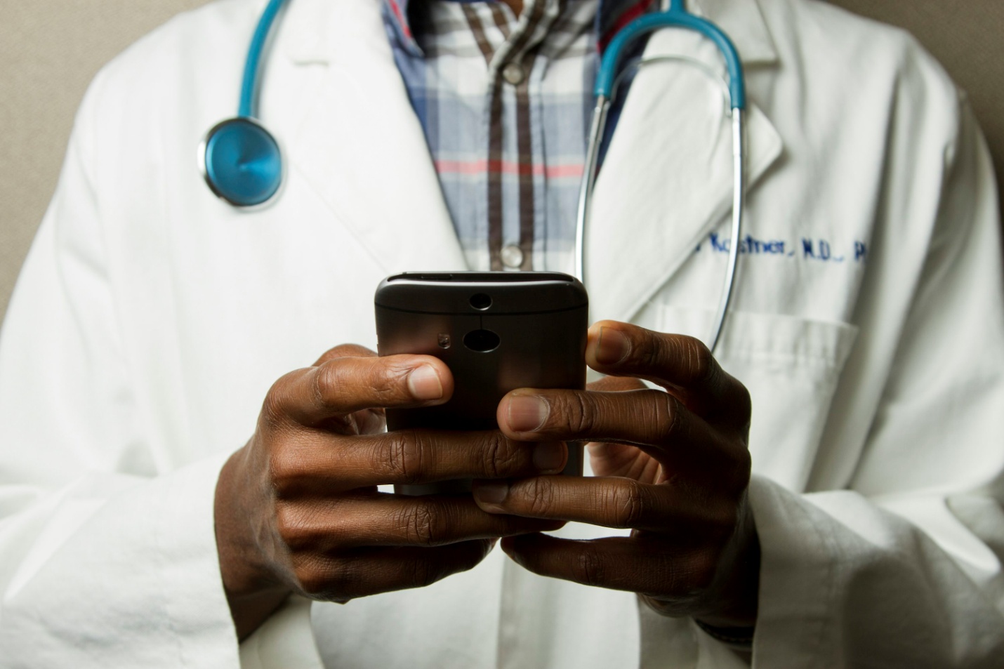 A doctor holding their phone