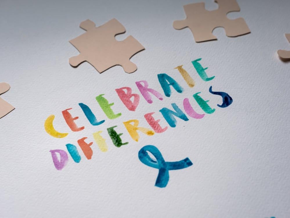 Puzzle pieces placed on a note written on a paper