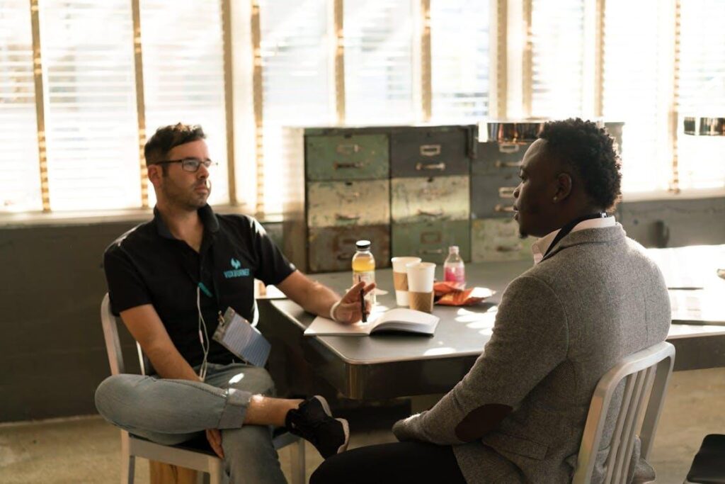 Two employees talking in a workspace