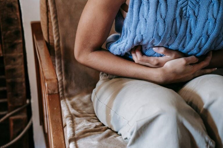 A person holding their stomach